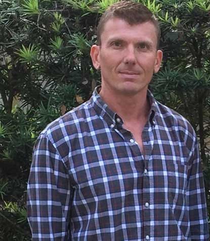 Physical therapist Trevor Gilliam assisting a patient with rehabilitation and balance training at Palm Coast Physical Therapy