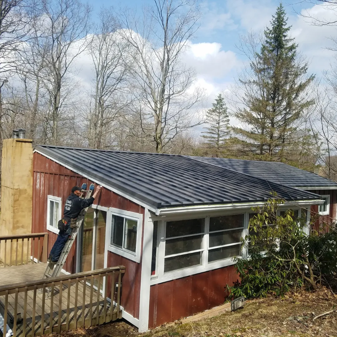 Roofer from All About Renovations on roof in Westmoreland County, PA