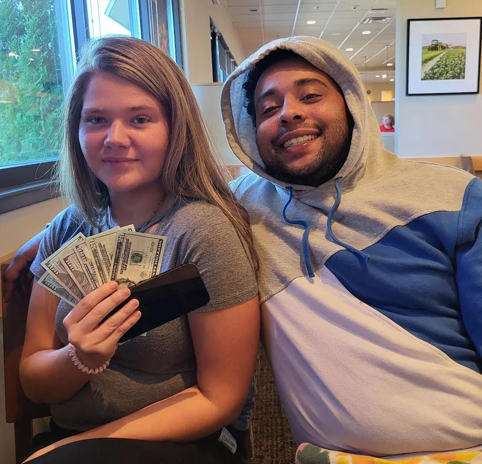 person holding smartphone screen