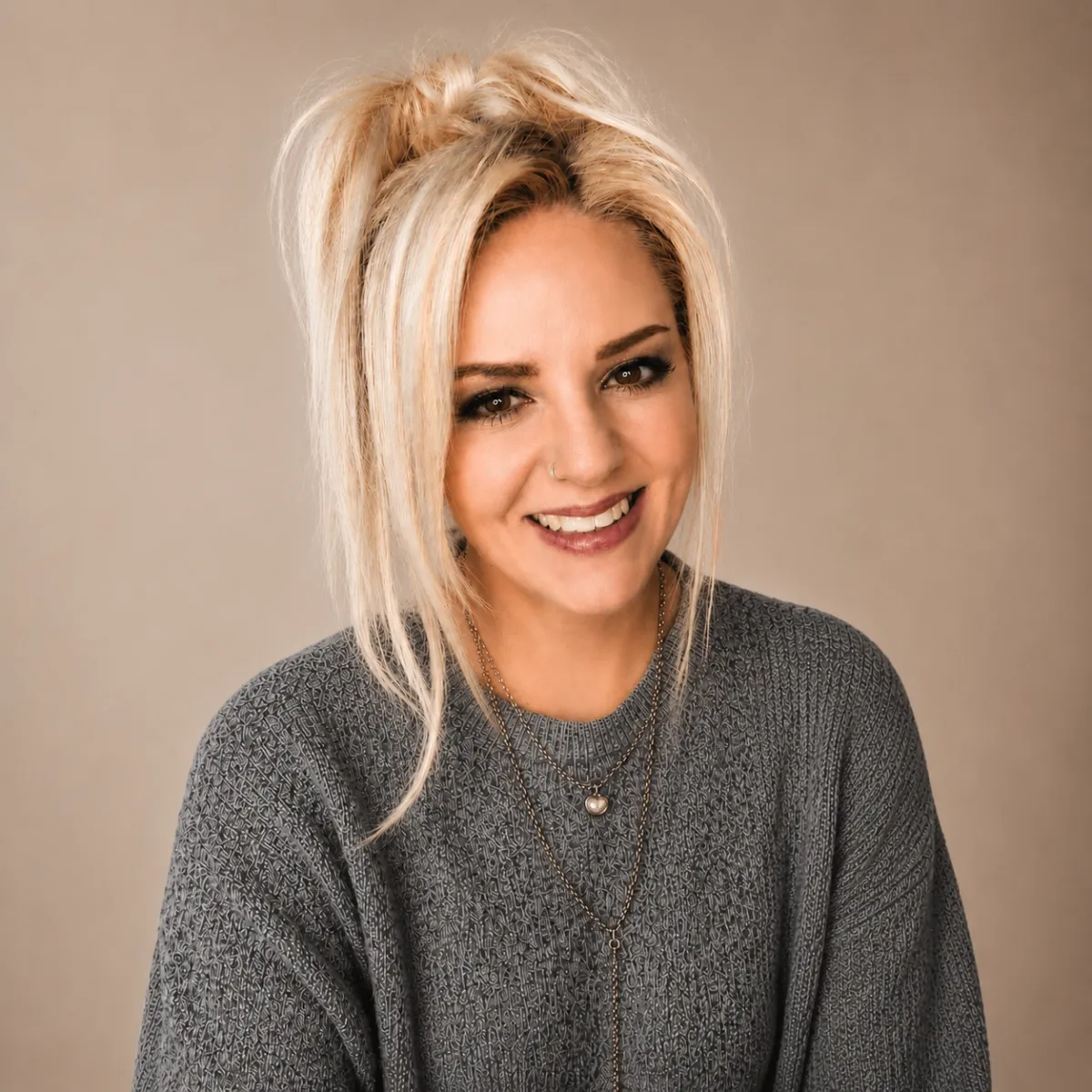 bianca may image in grey sweater smiling