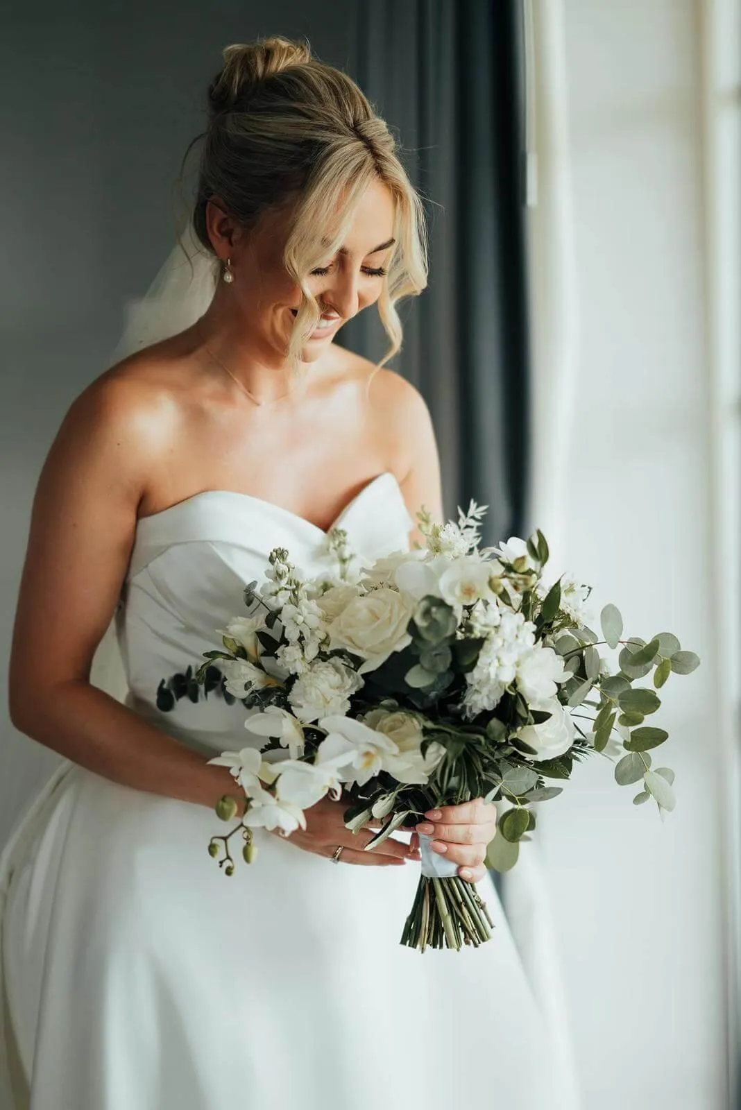 Glowing bride getting her make done