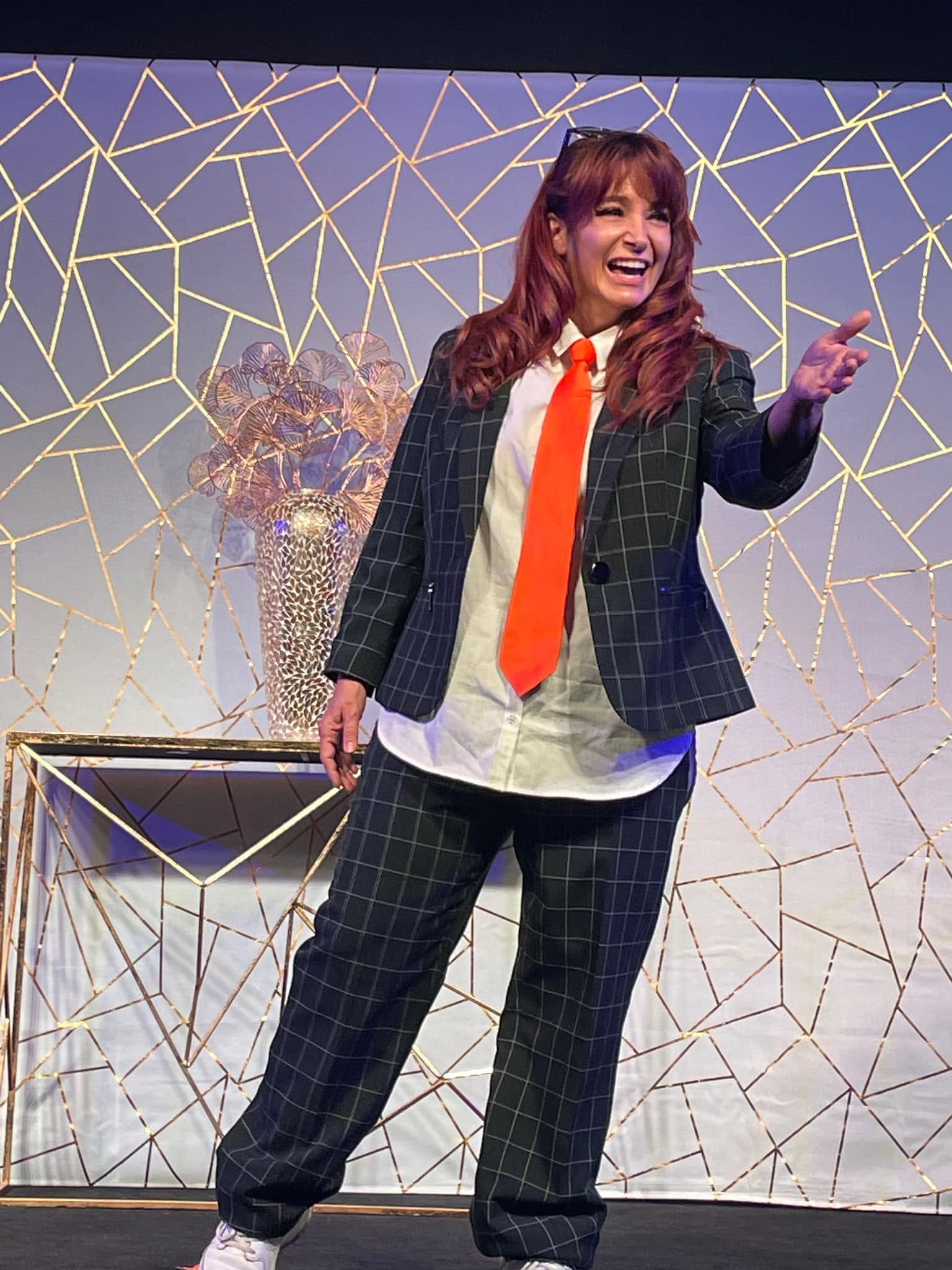 Amy Jo Honey delivering a captivating keynote to a large audience