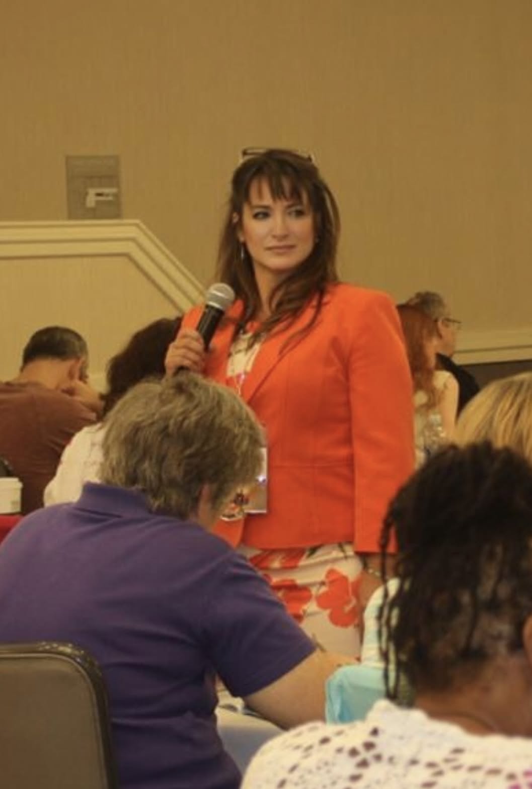 Amy Jo Honey leading an intimate corporate sales training session in a boardroom