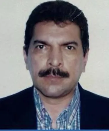 man wearing watch with black suit