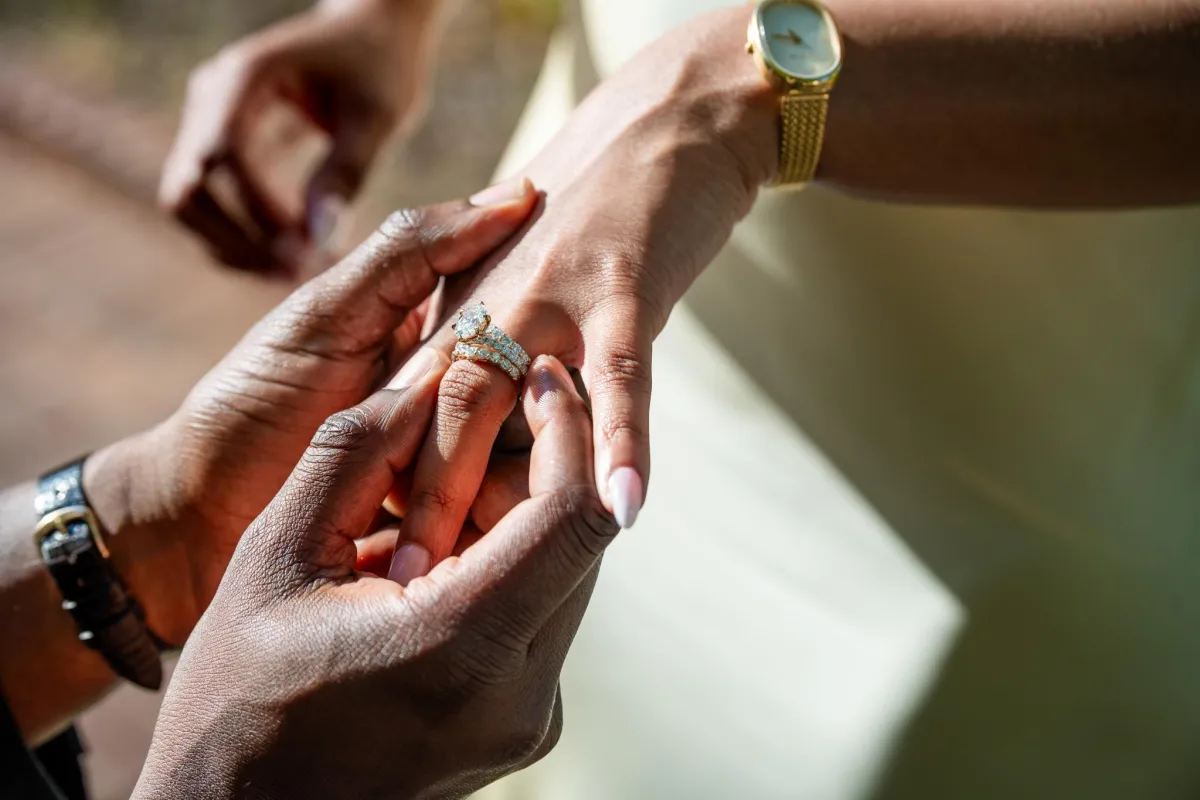 man and woman wearing silver-colored rings