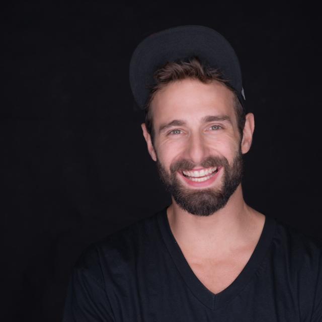 Content technologist adjusting lighting grid in studio