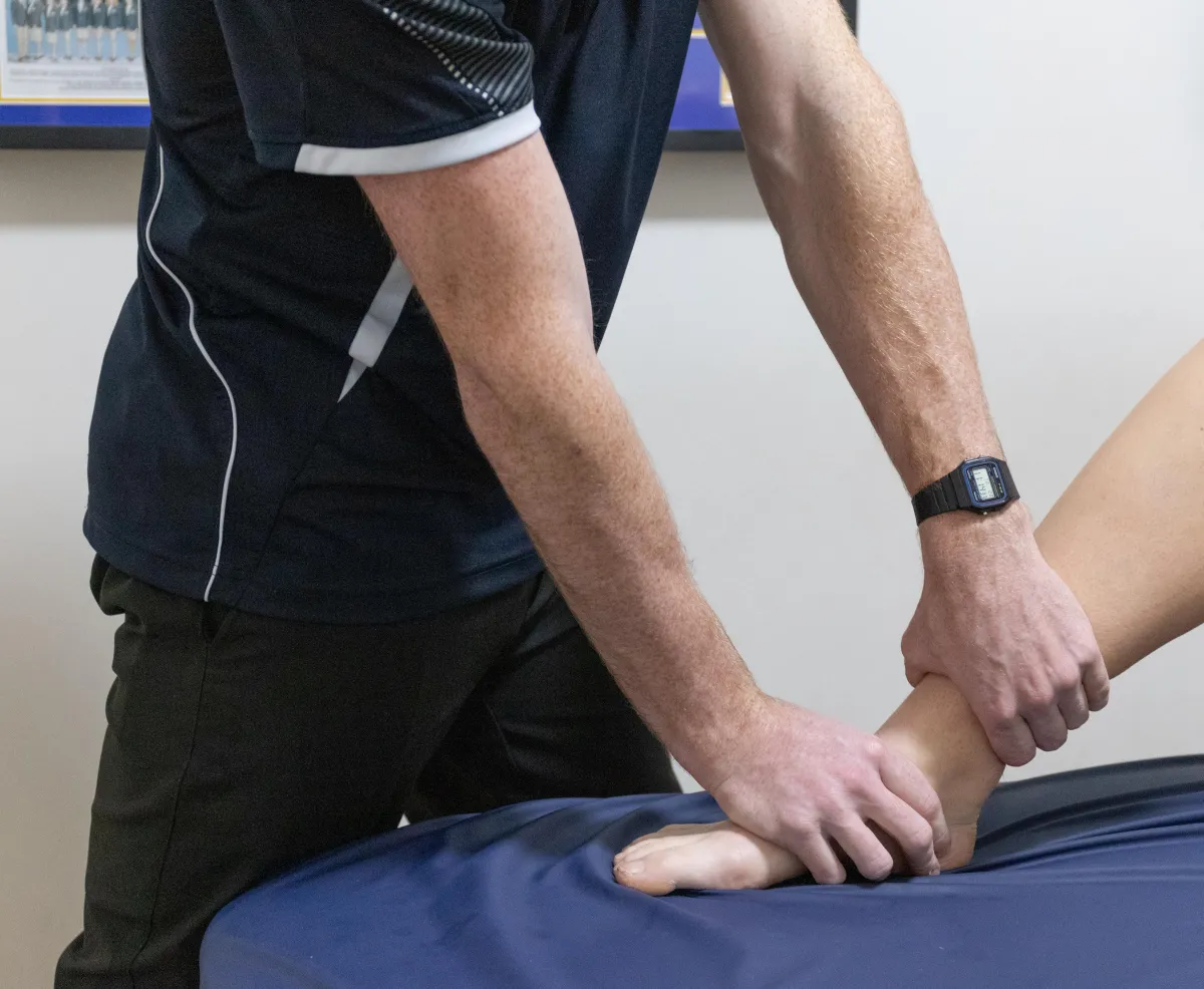 Physio treating client