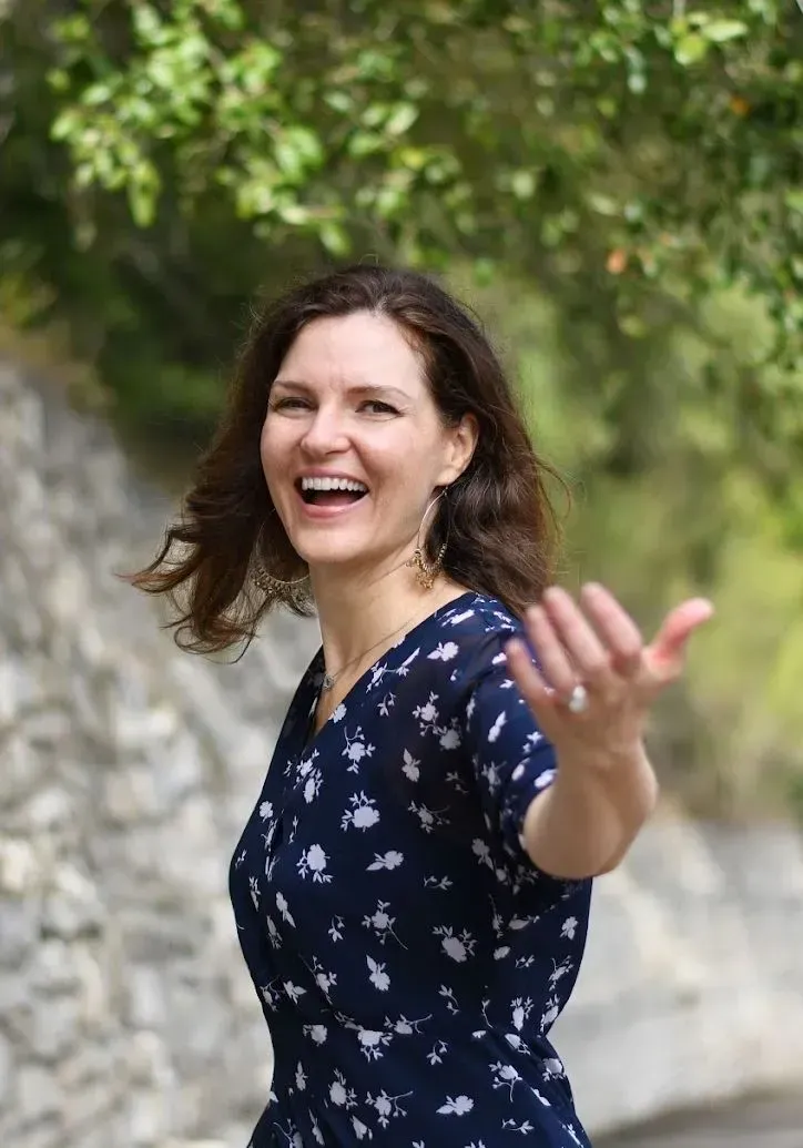 Sharon Seaberg executive coach smiling outdoors with an open, inviting presence