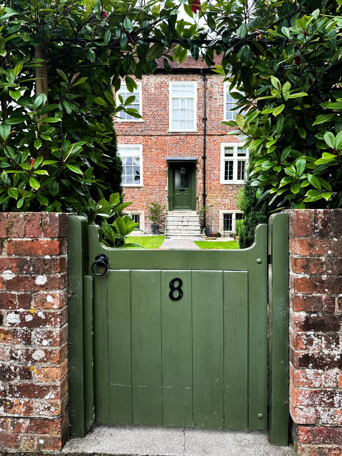 Home that is suitable for equity release with a green gate and large garden