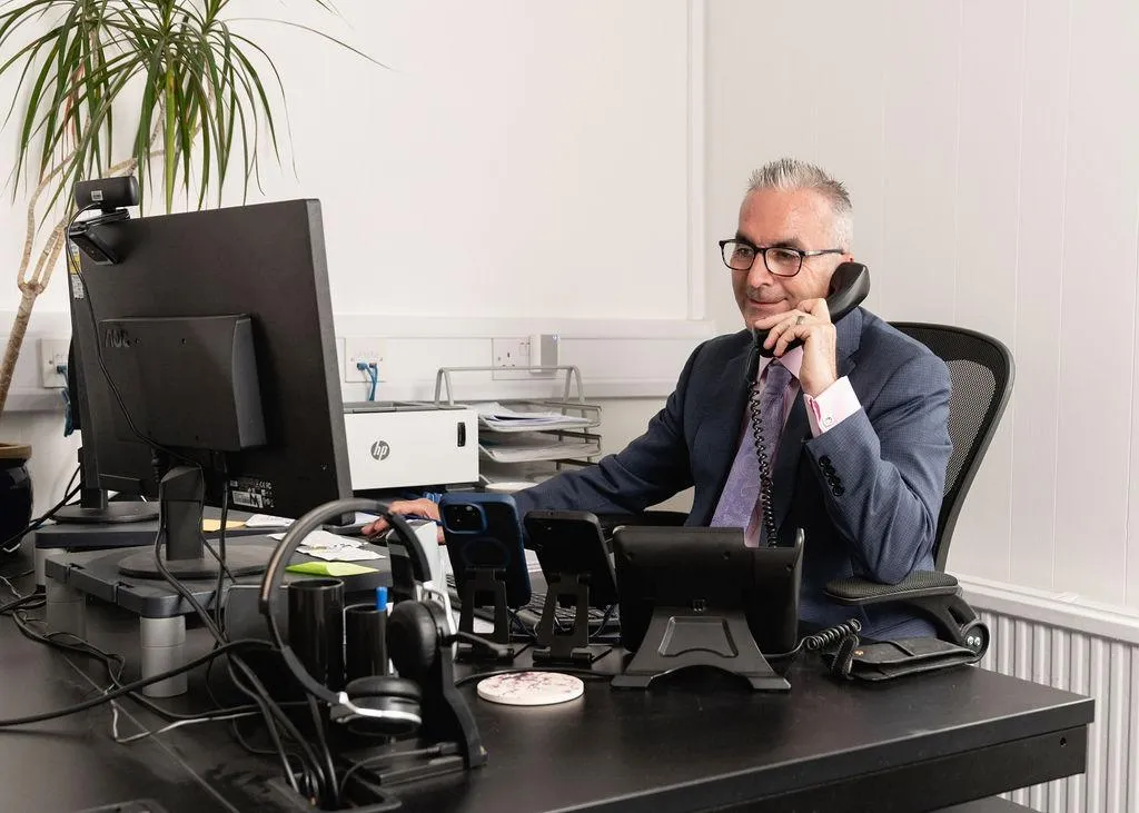 Experienced advisor at Aspect Mortgages working at his desk