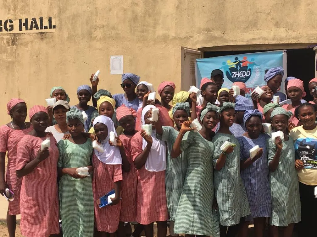 man holding incandescent bulb