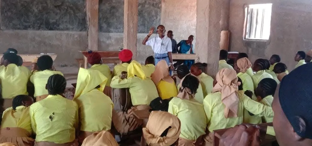 man holding incandescent bulb