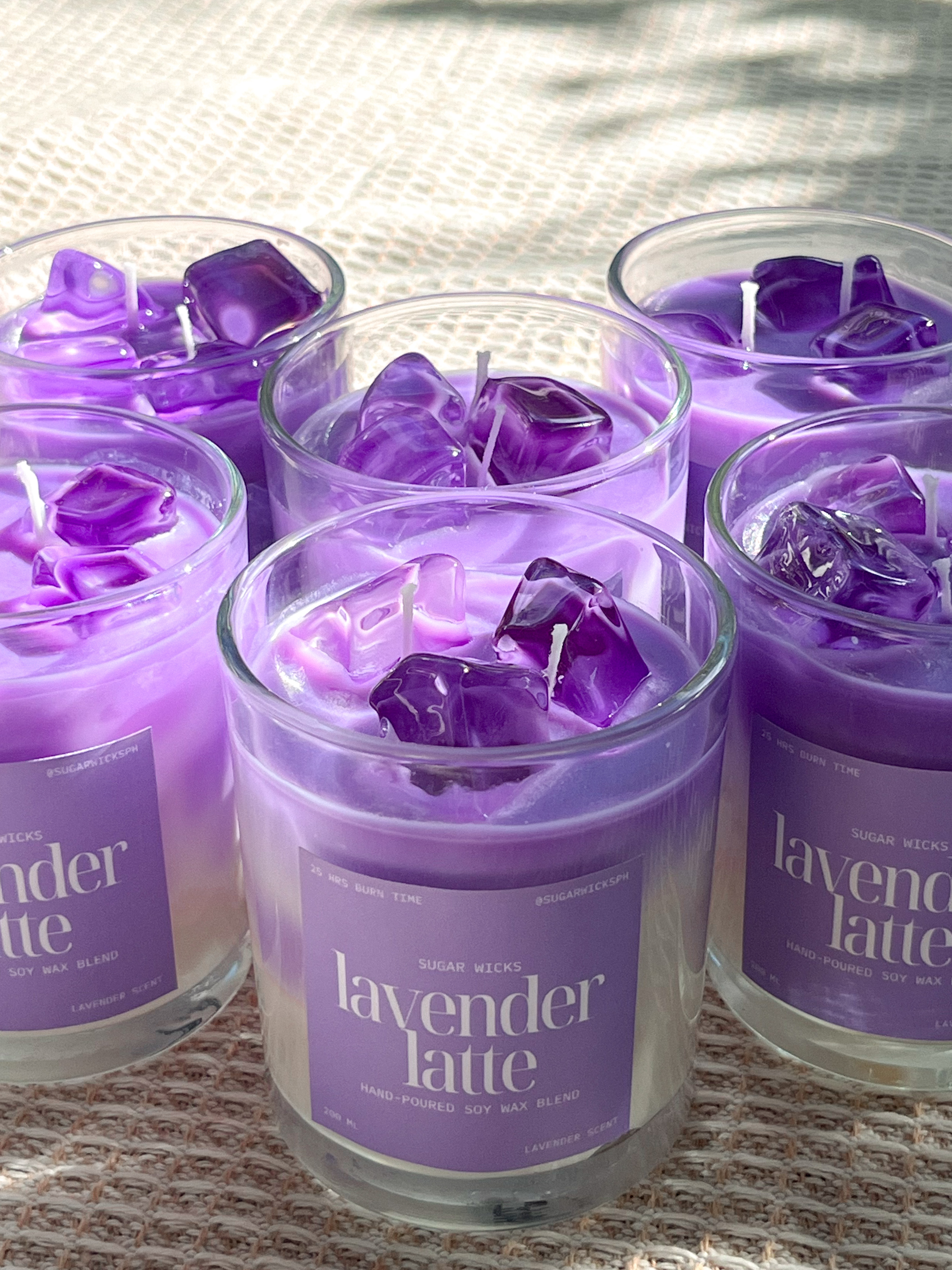 Blush-toned trio of Sugarwicks candles in glass jars.