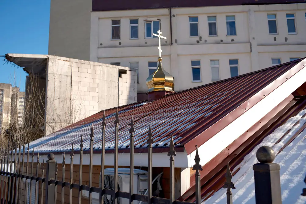 House exterior featuring a charcoal standing seam metal roof