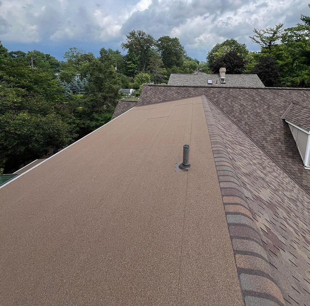 House exterior featuring a charcoal standing seam metal roof