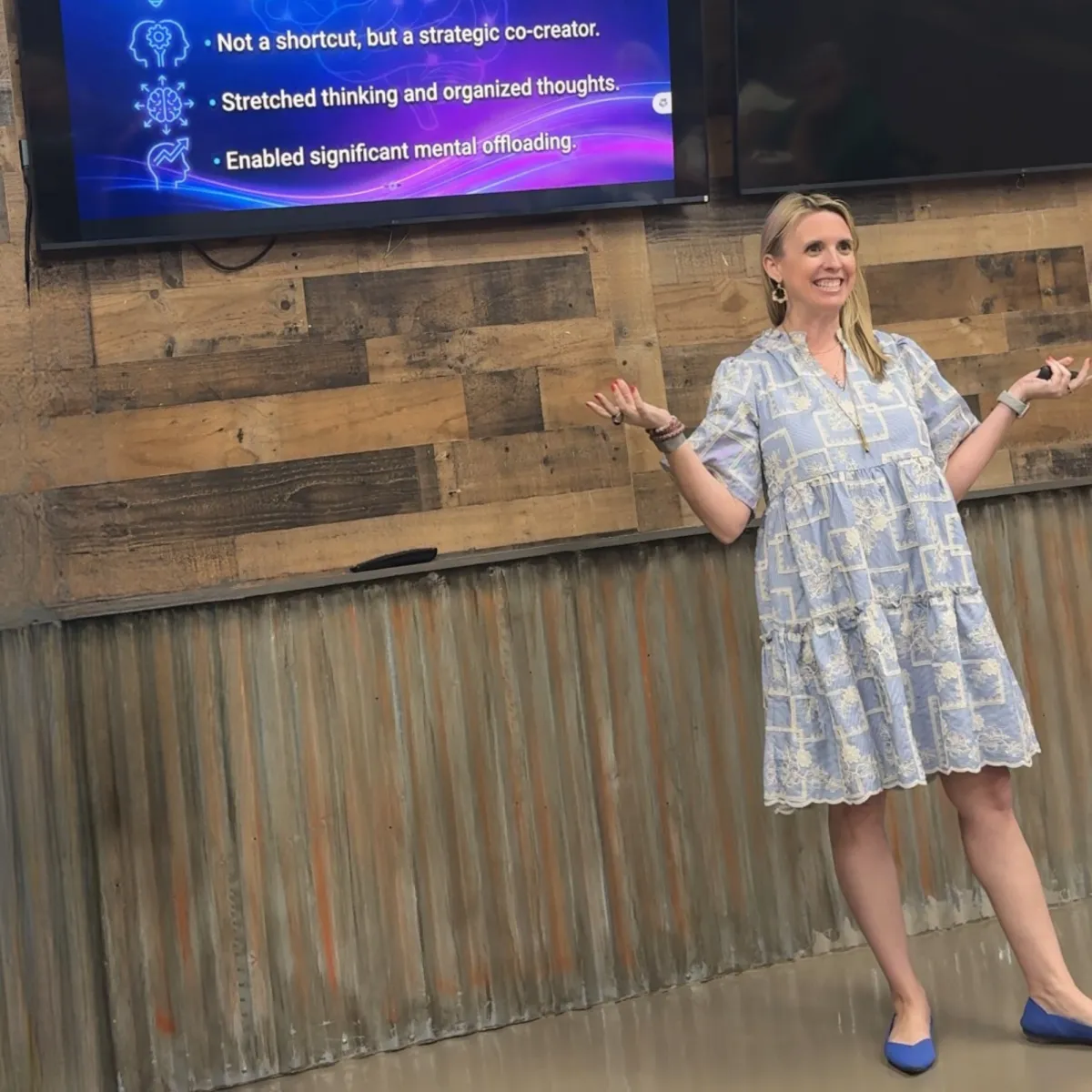 Close-up of Jax mid-talk with headset microphone, hands gesturing, dramatic purple-blue stage lights, cinematic photorealistic capture that conveys momentum and workshop energy.