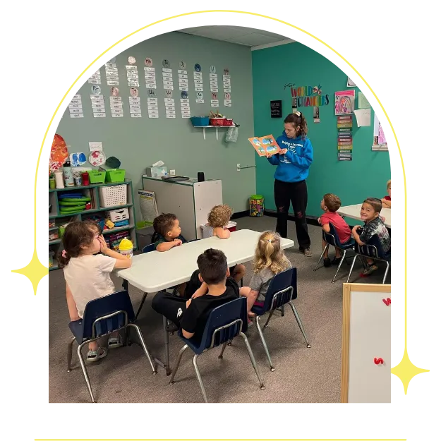 Teacher reading to children.