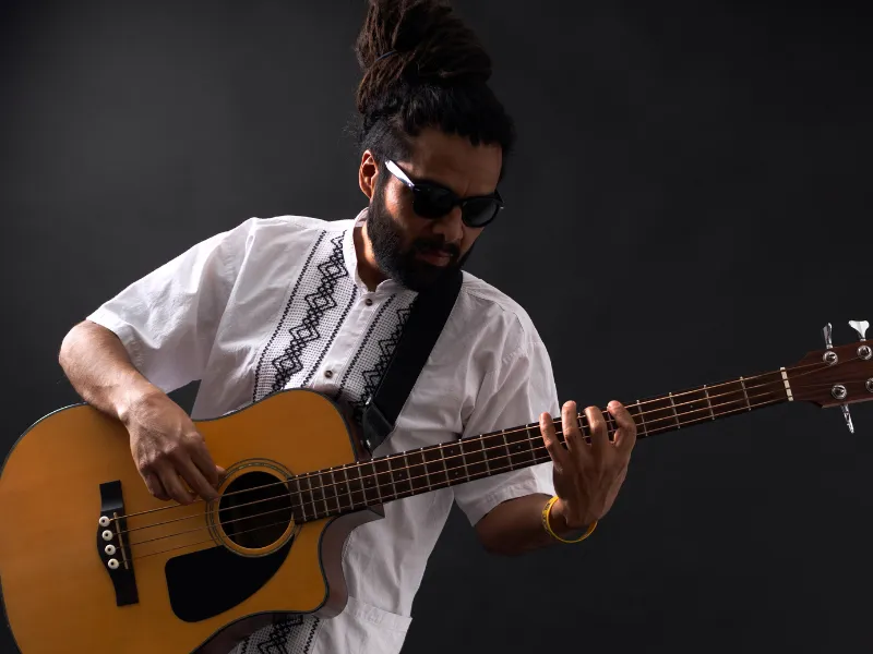 Adult male enjoying learning Bass Music Lessons at Lochwood Academy