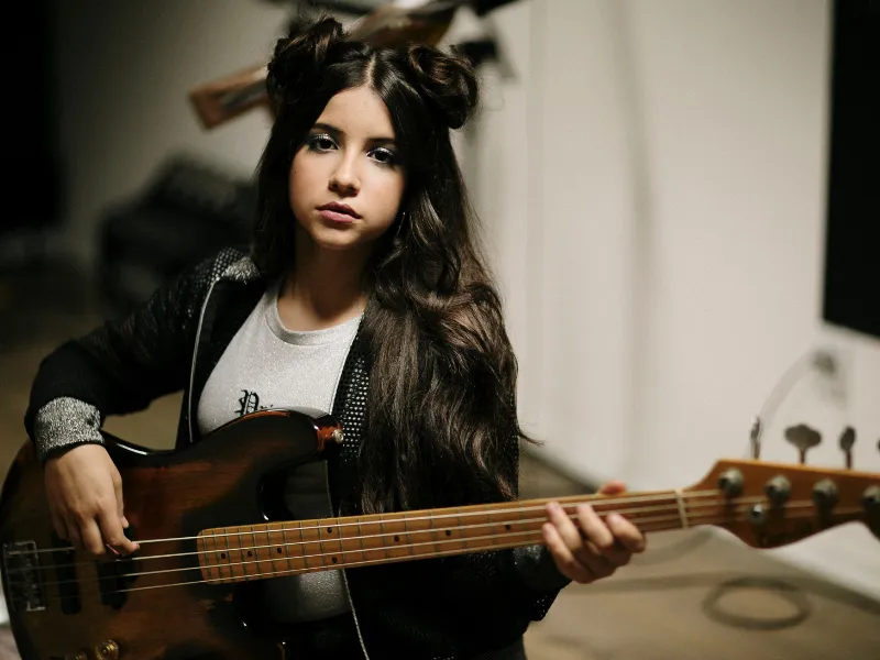 Kid girl ready to take her journey in learning Bass guitar at Lochwood Academy. 