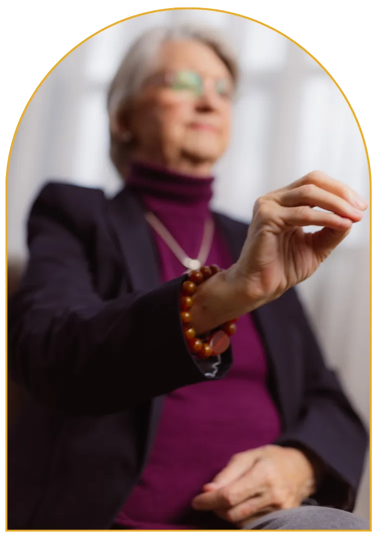 person holding stack of stones