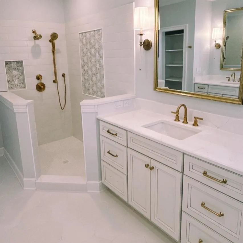 Custom tile shower with niche and frameless glass in Williamsburg VA