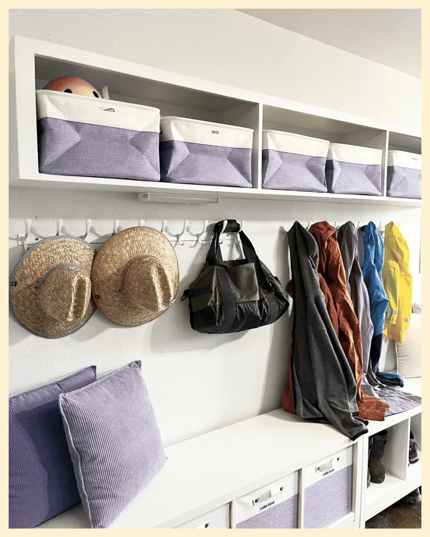 Organized pantry with labeled containers, categorized bins, and baskets creating a clean and functional kitchen storage system