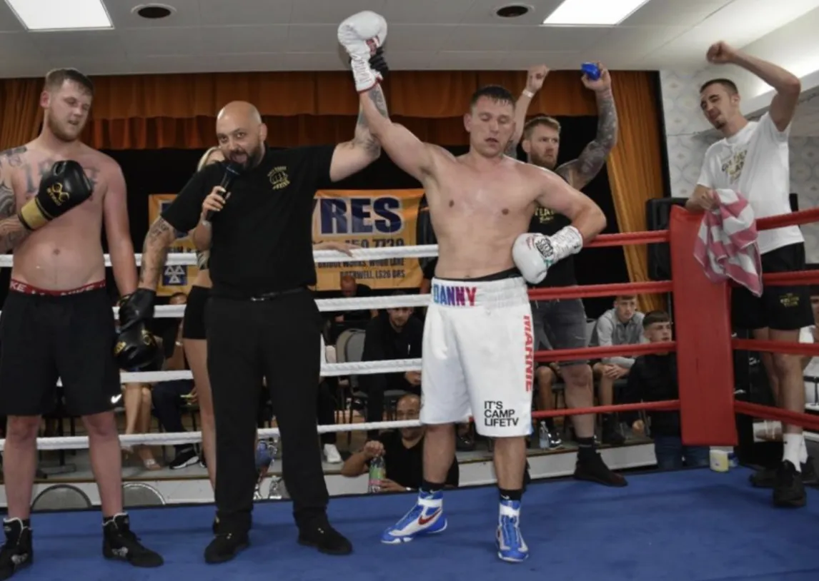 a person standing in front of a sign