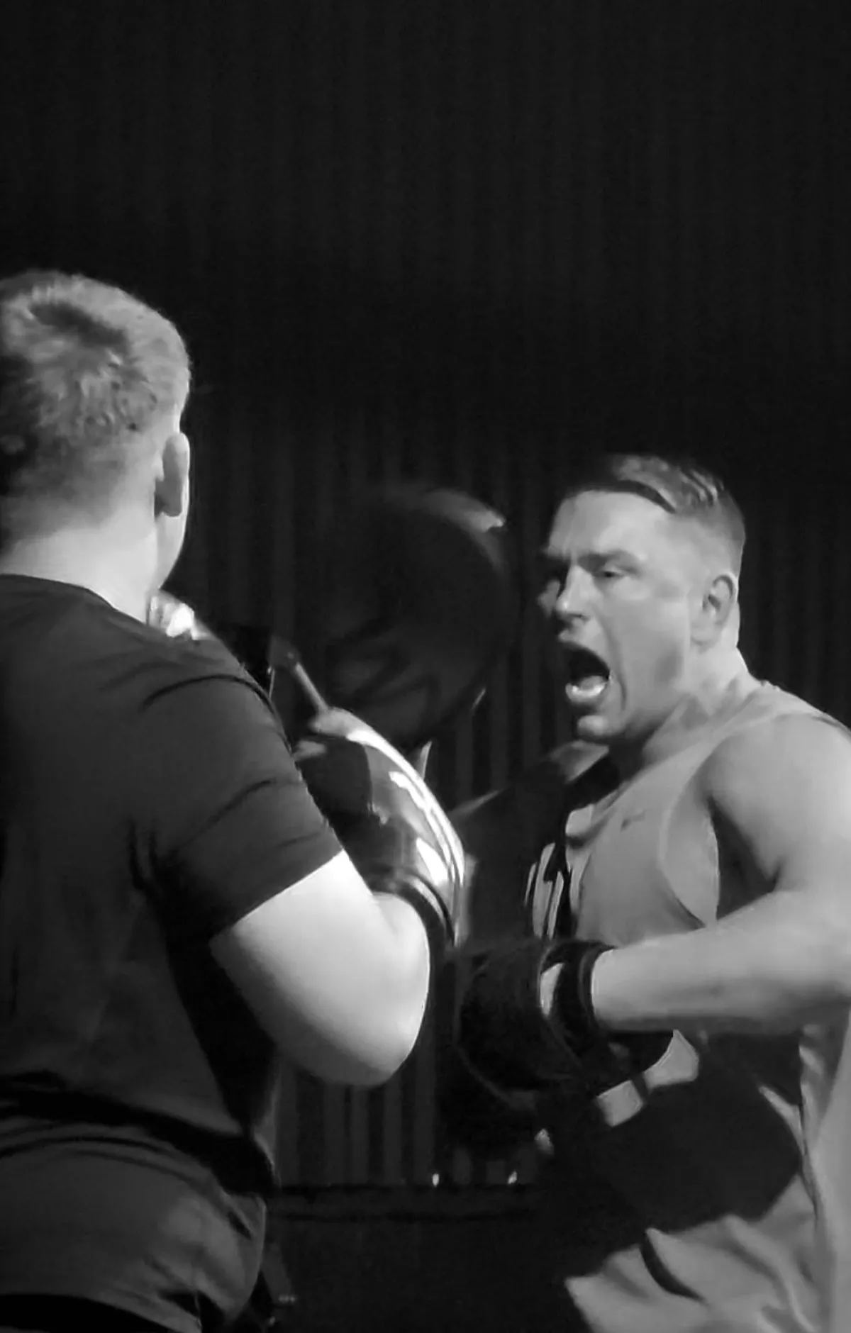 A man standing on top of a boxing ring