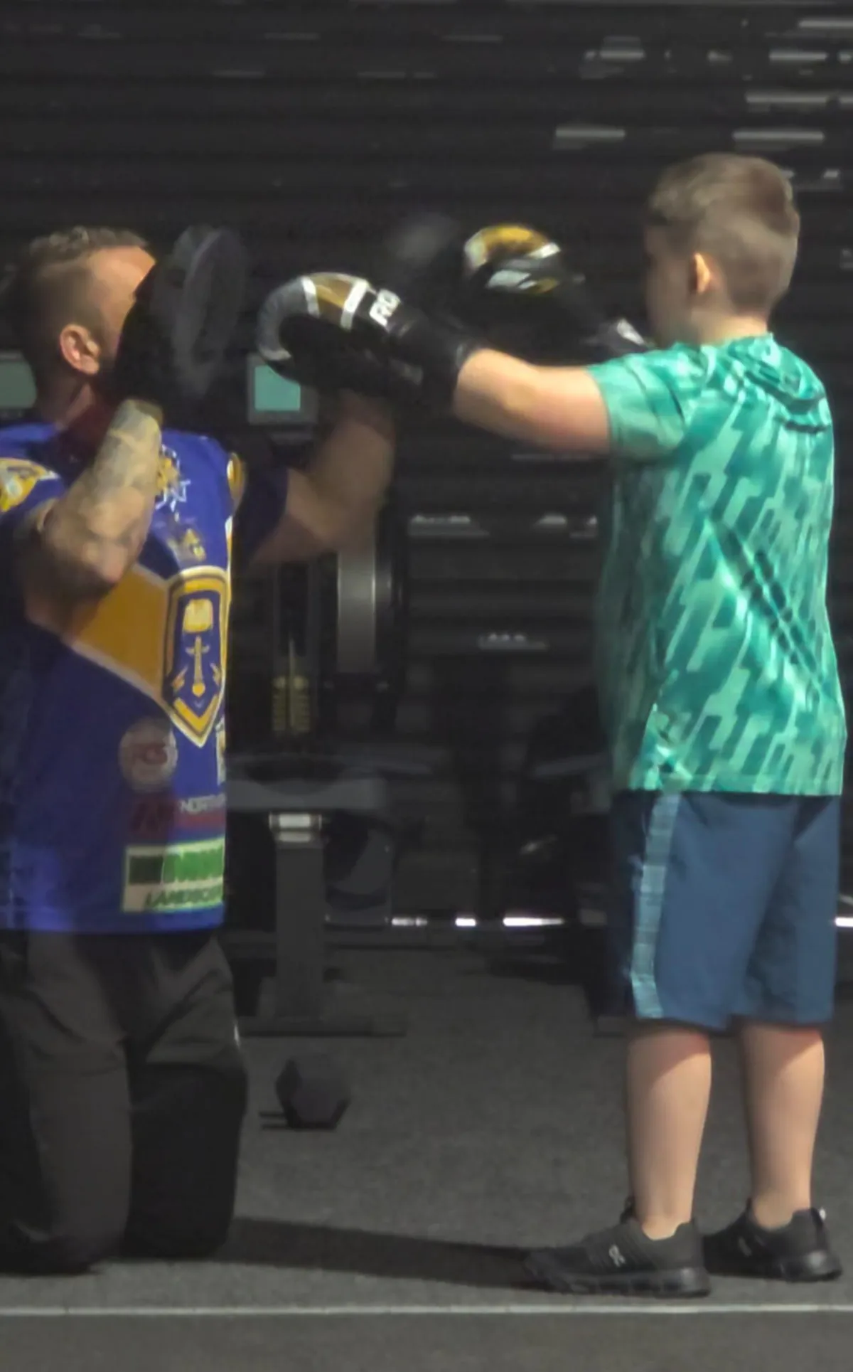 a pair of boxing gloves hanging from a hook