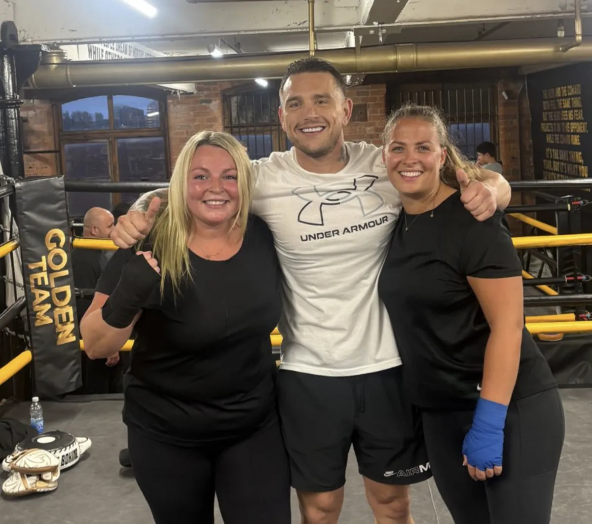 man red and black top running on farm road