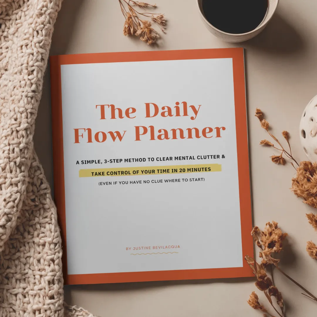 Daily Flow planner on table with coffee next to it