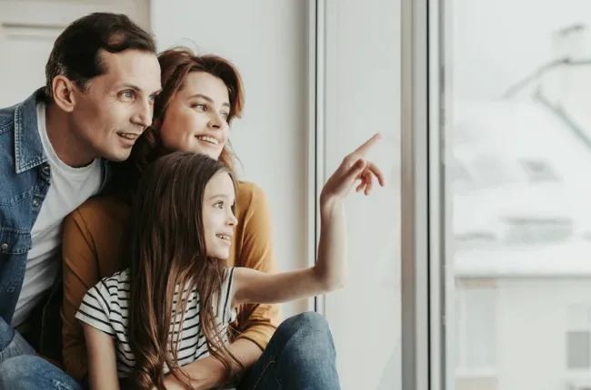 a close up of a wooden door with metal handles