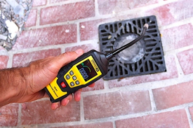 The Drain Smith Technician diagnosing sewer gas odor source and vent issues at Cincinnati Ohio property.