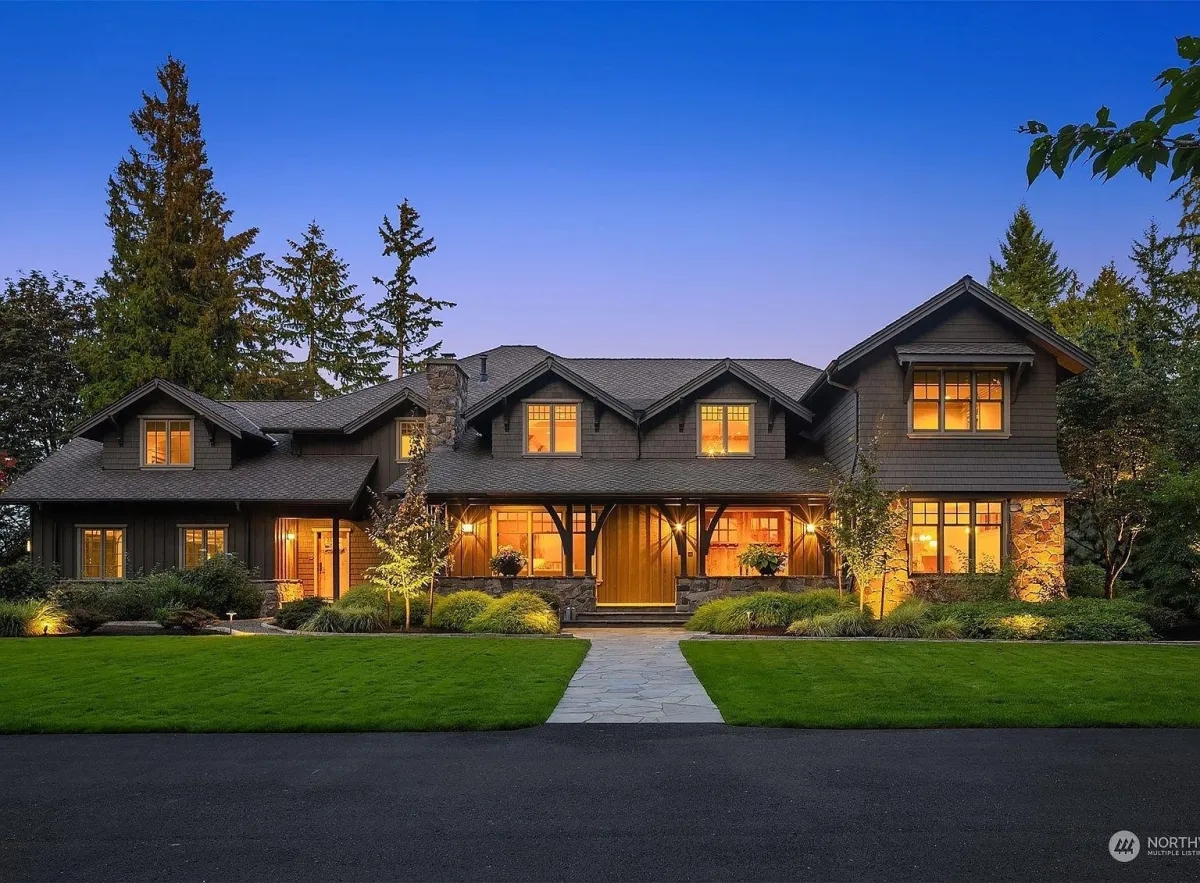 Pacific Northwest home with warm interior lights on a cool fall evening.
