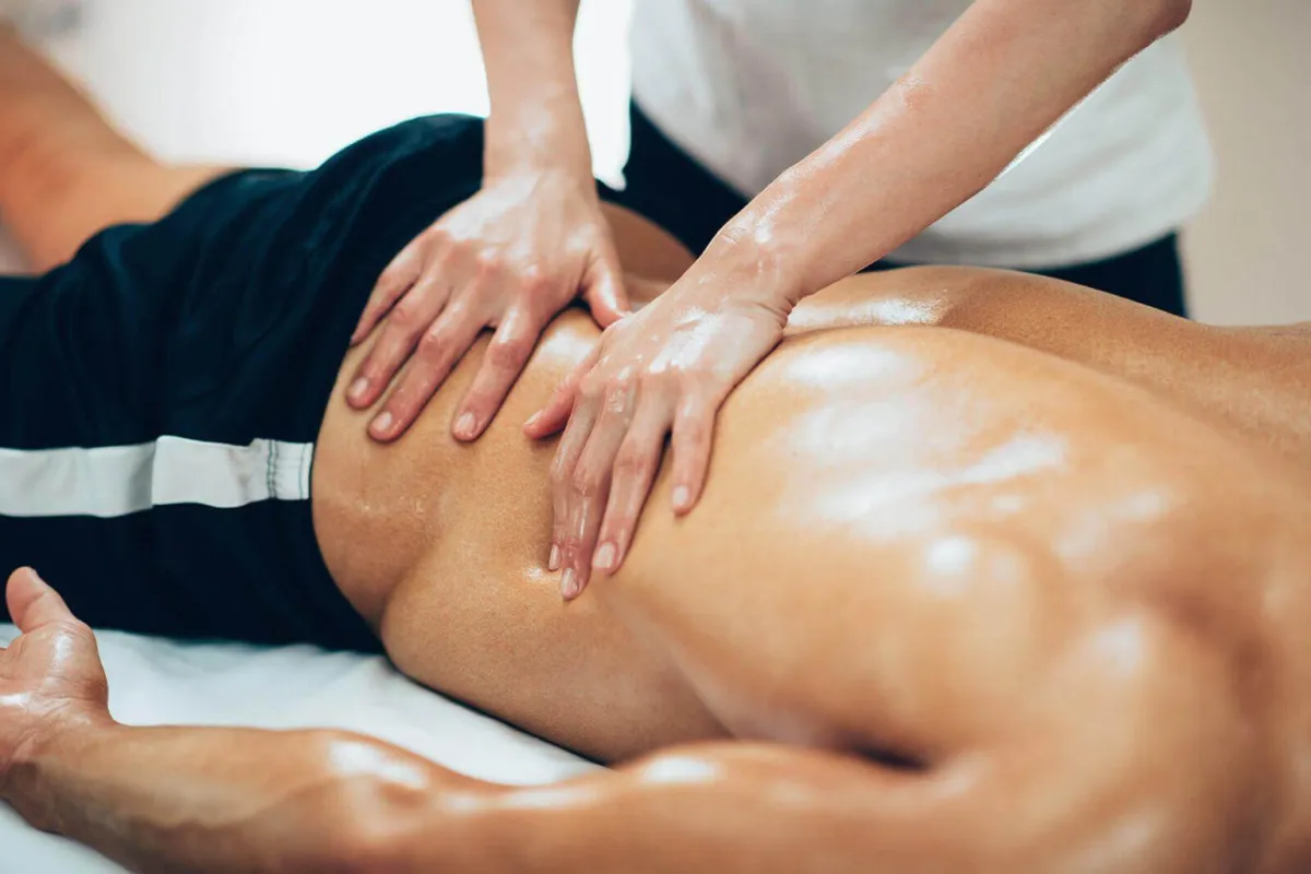 Sports Massage Therapist Treating Shoulder Injury in Kirkland