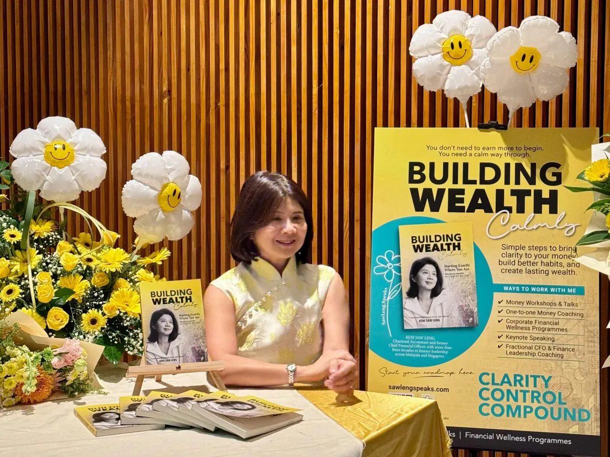 Display of the printed book Building Wealth Calmly at the event