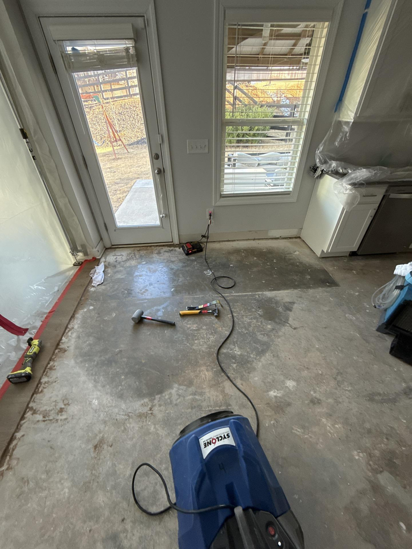 a close up of a water fountain with a building in the background