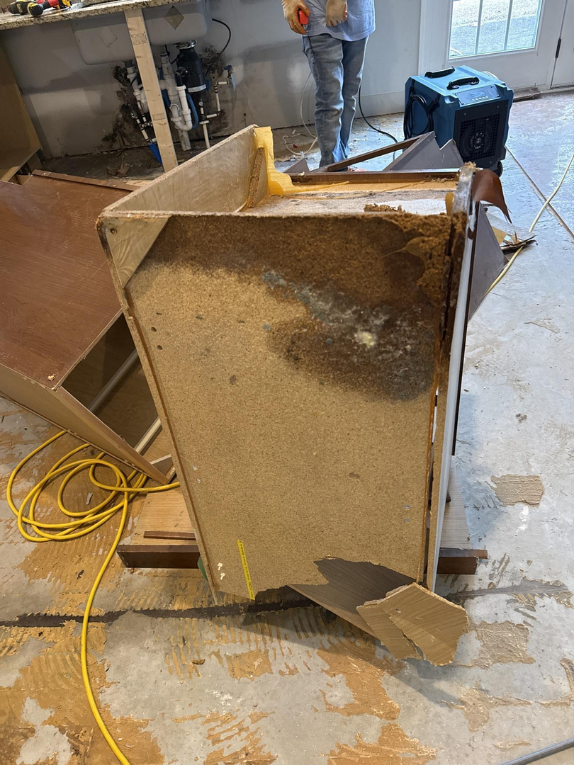 a small stream of water running through a lush green field