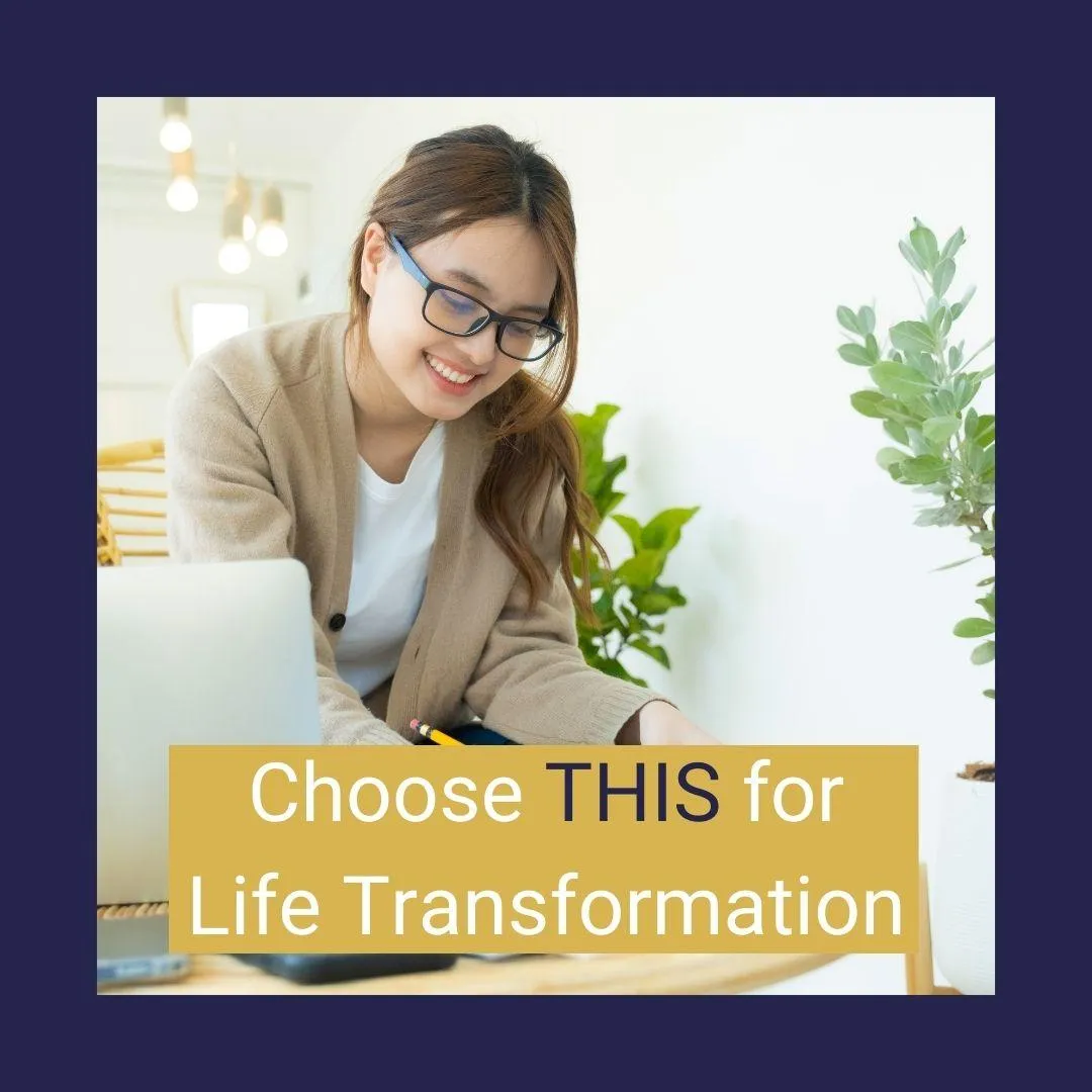 image of woman smiling and working on laptop