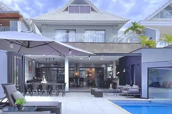 gray wooden door near green plants during daytime