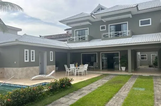 white and grey concrete building near swimming pool under clear sky during daytime