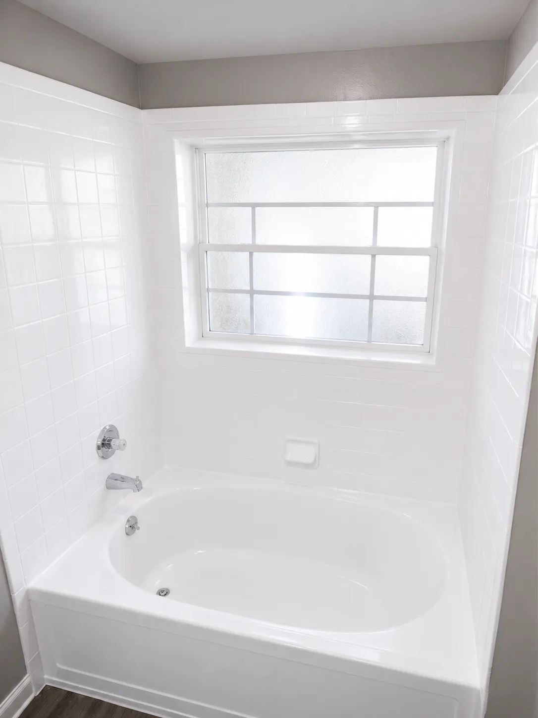 Pristine professionally refinished white bathtub in a modern bathroom