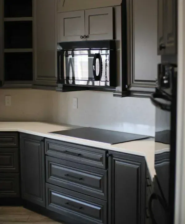 Modern kitchen cabinets with professional painting and smooth dark gray finish in Arizona home
