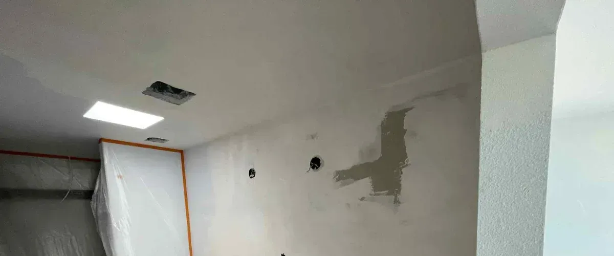 nterior drywall repair with patched wall during home renovation project