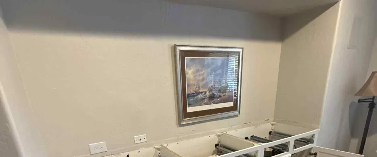 Interior wall prepared for painting with cabinets removed