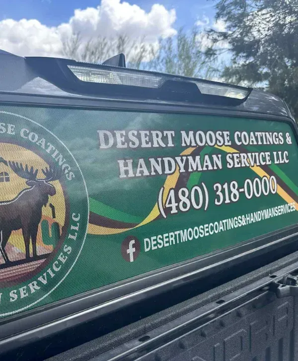 Desert Moose Coatings and Handyman Service LLC truck window branding with phone number and logo