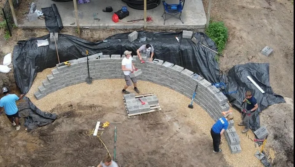Boulder retaining wall built into sloped yard in Twin Cities