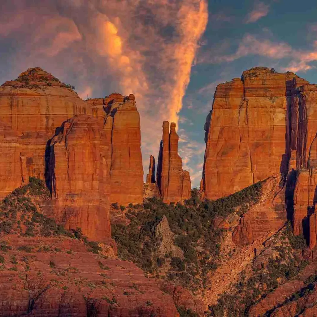 Stunning, iconic view of the Red Rocks State park with sunset-kissed cloud above.