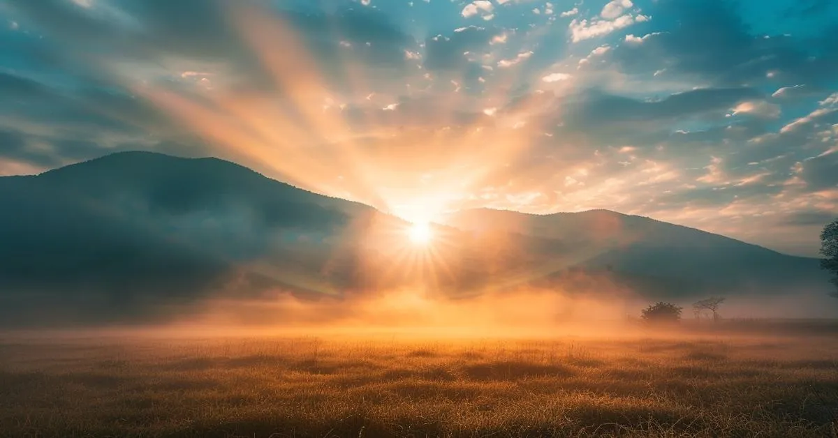 Golden sunrise over soft morning mist, representing awakening through light and grounded peace — a serene balance between earth and sky.