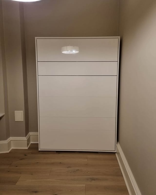 Murphy bed and panelled wall installation by Core Joinery & Interiors